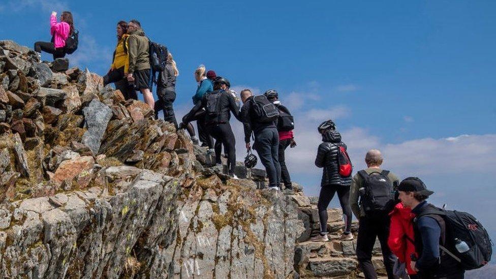 People queuing at the top of Snowdon