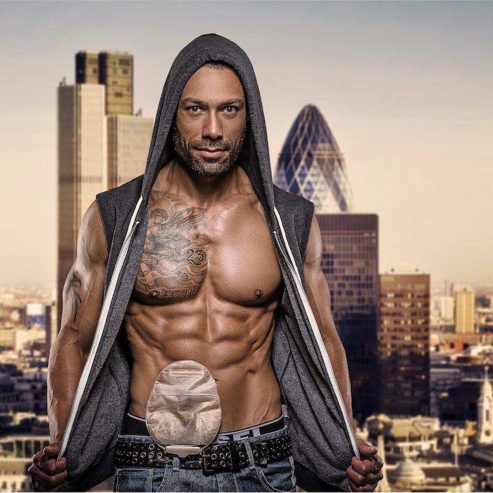 Blake Beckford standing topless in front of the London skyline