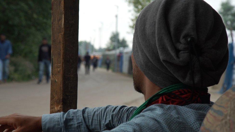 A migrant in the Calais camp