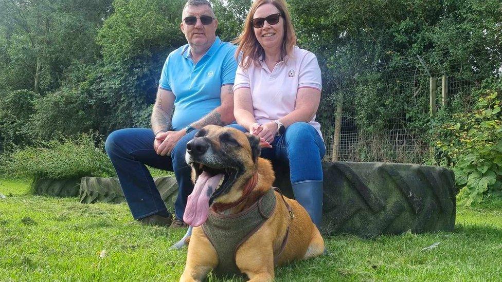 Mike Palmer with his wife Debbie and new addition Chase the dog