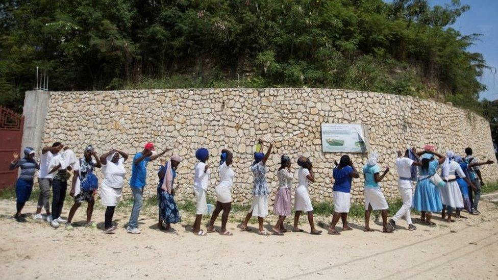 Believers gather to pray outside the church of St Rock for the release of clergy members, including two French citizens, who were kidnapped on Sunday, in Port-au-Prince, Haiti April 12, 2021