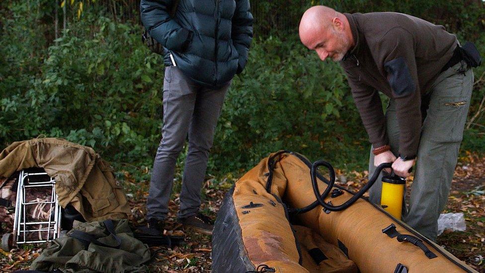 Peter Stanford pumps up his canoe