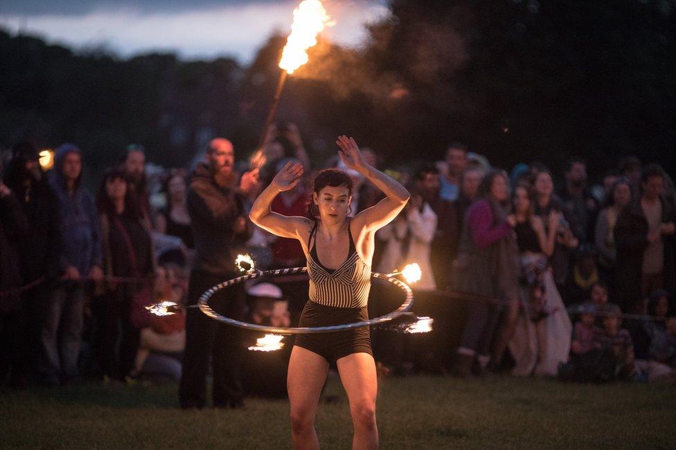 People gather at Avebury Neolithic henge monument, a UNESCO World Heritage site, for the summer solstice