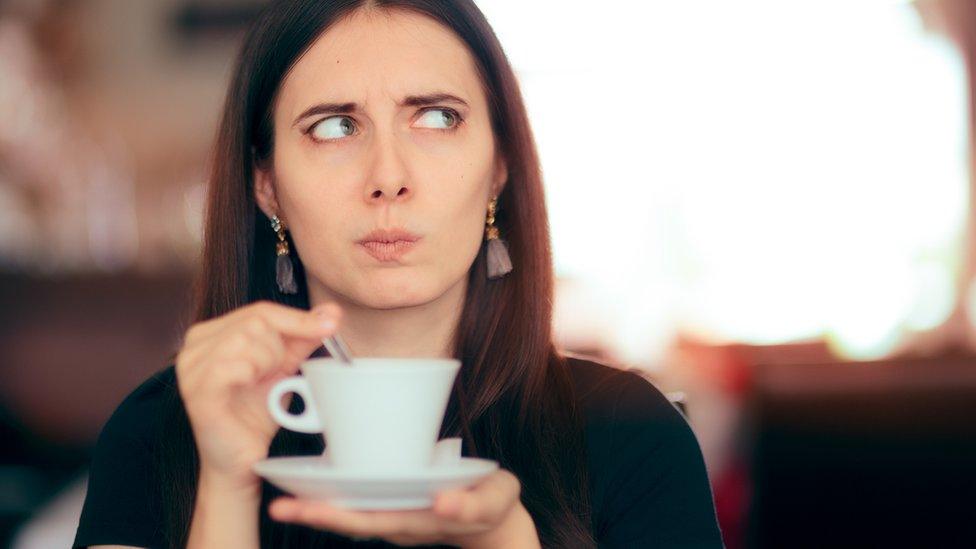 Woman drinking a cup of tea