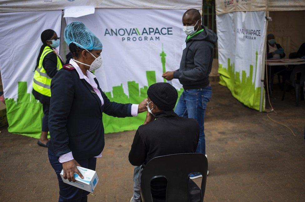 Medical staff prepare to test another person for Covid-19 Coronavirus at a reutine testing station on day 13 of the 21 day national lockdown following President Cyril Ramaphosa declaration of a National Disaster in Johannesburg, South Africa