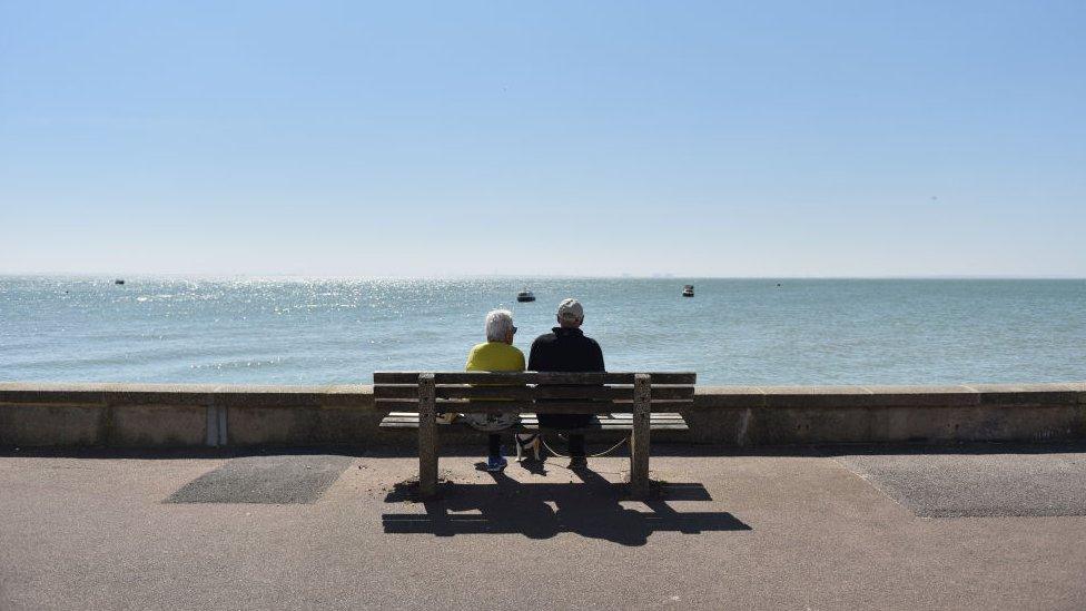 Couple looking out to sea