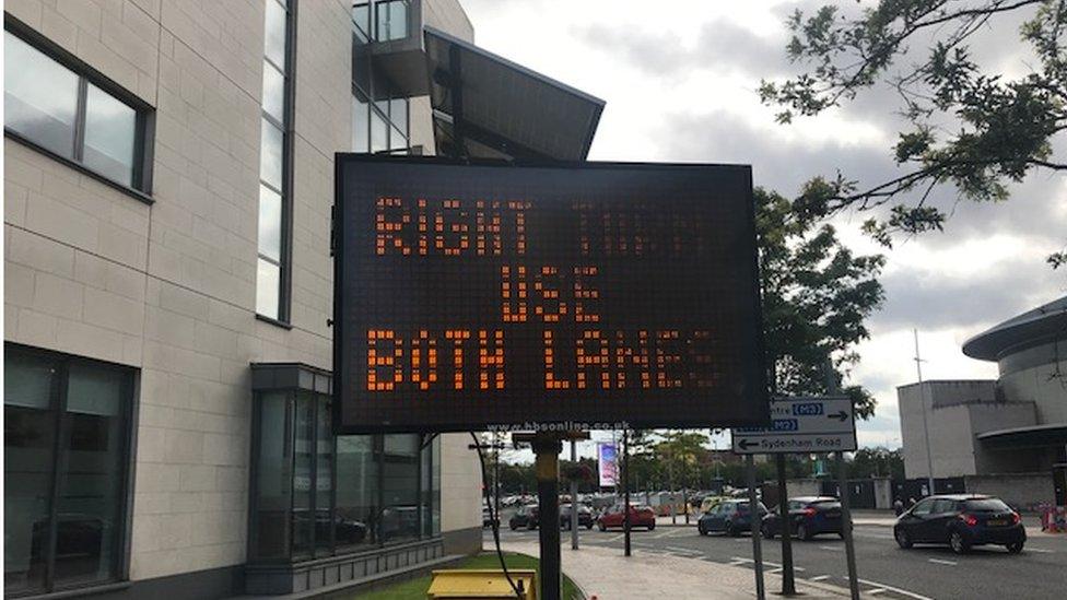 Traffic directions near Queen's Road in Belfast