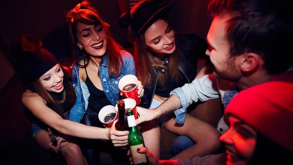 Students drinking (stock photo)