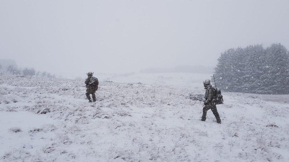 Soldiers walking through the snow in the Brecon Beacons