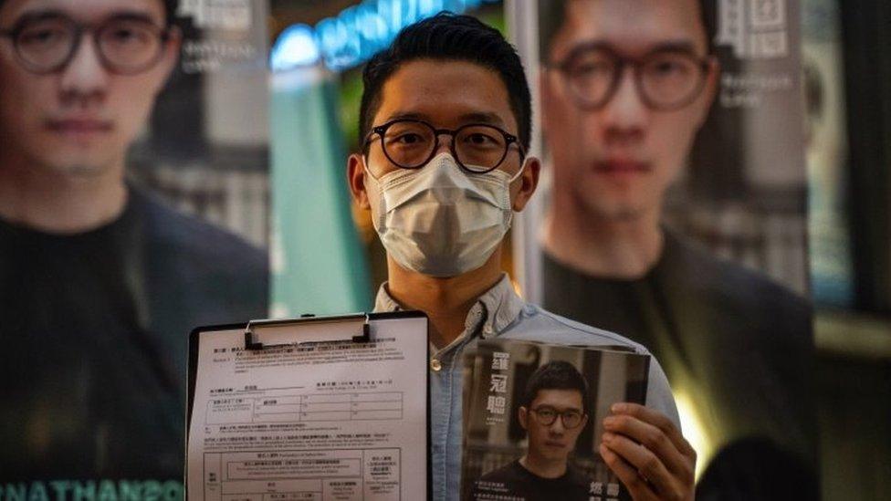 Pro-democracy activist Nathan Law speaks to members of media during a press conference on June 19, 2020 in Hong Kong, China