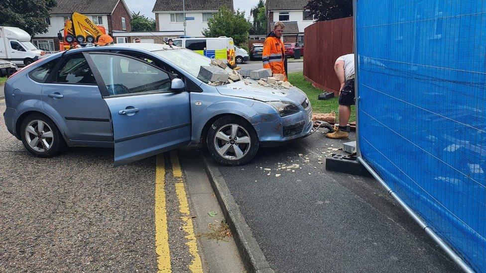 Car crashed into house