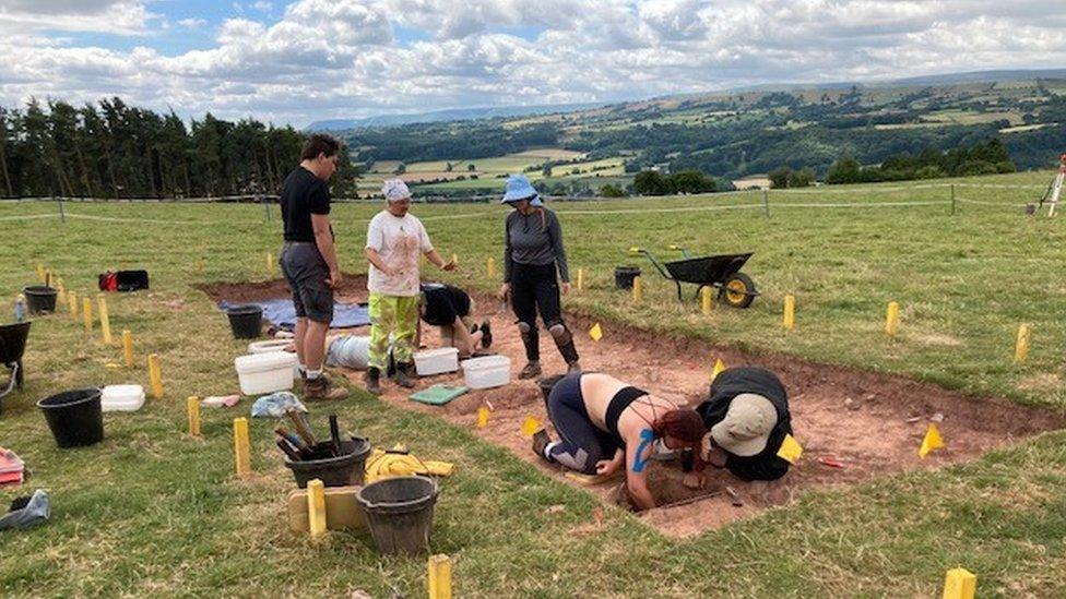 Archaeologists excavating the site