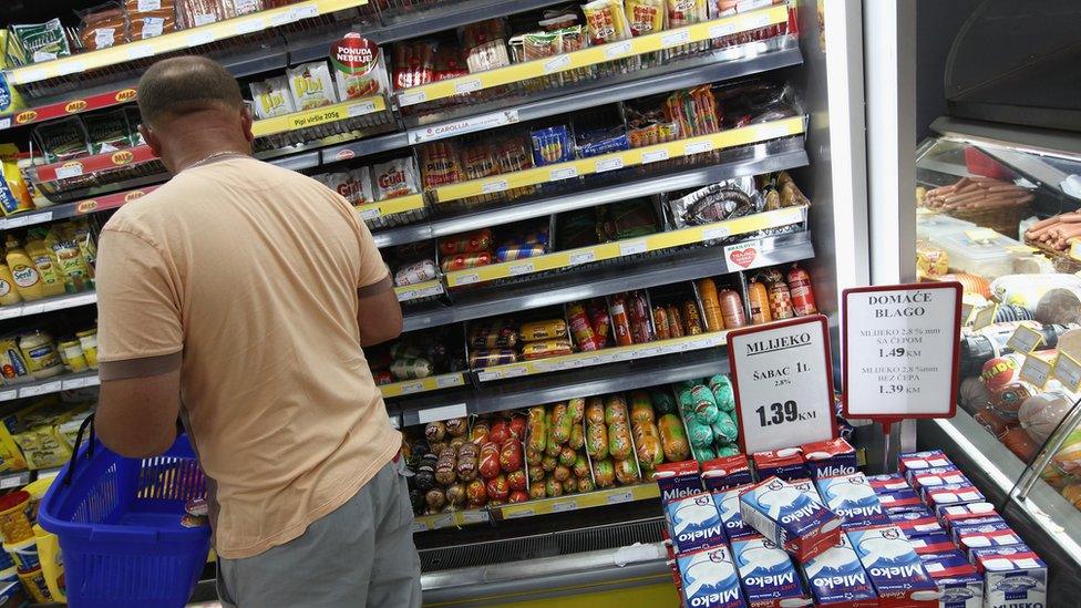 A man shopping in a Bosnian supermarket