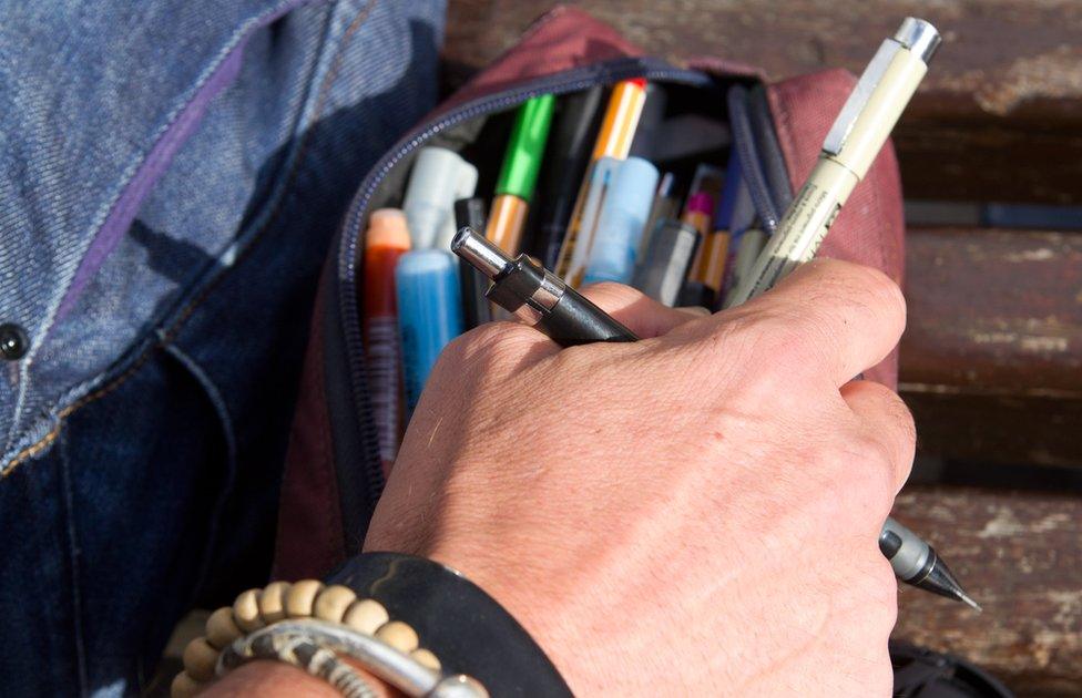 Stephen O'Grady reaching into his pencil case