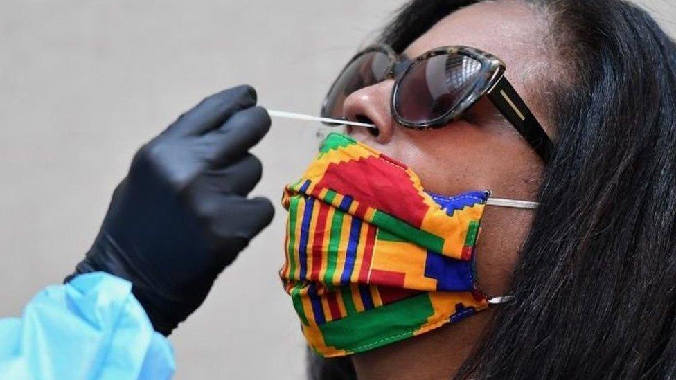 A woman having a swab test performed on her