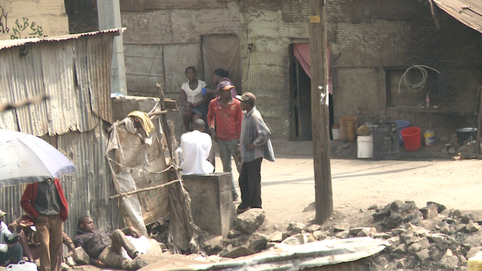 Young men gather in Mathare slum