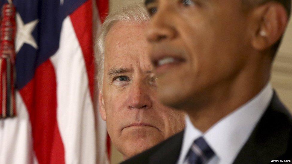 Vice-President Joe Biden stands behind President Barack Obama.