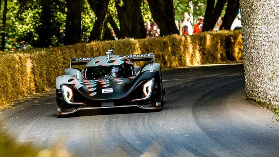 Roborace car racing up the hill climb at Goodwood