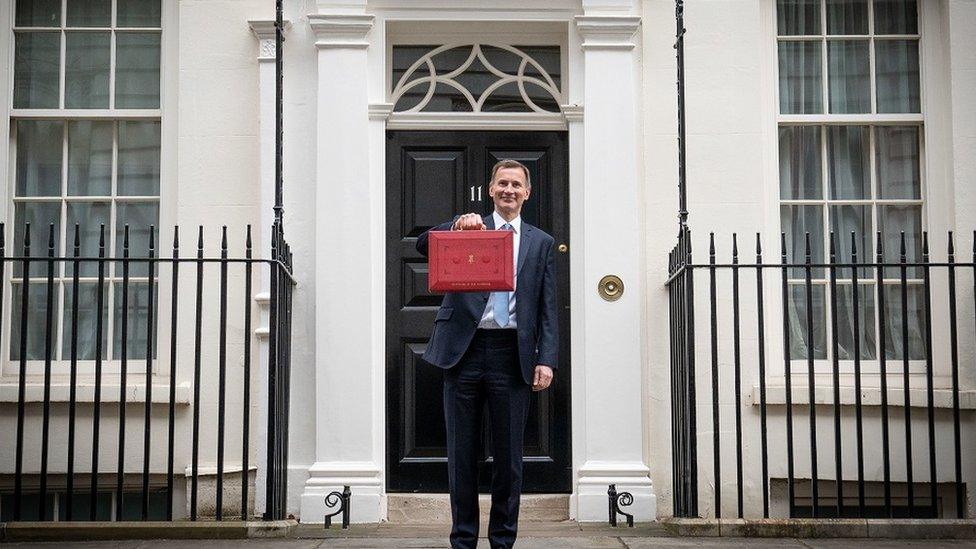 Jeremy Hunt pictured holding the chancellor's red briefcase outside 11 Downing Street