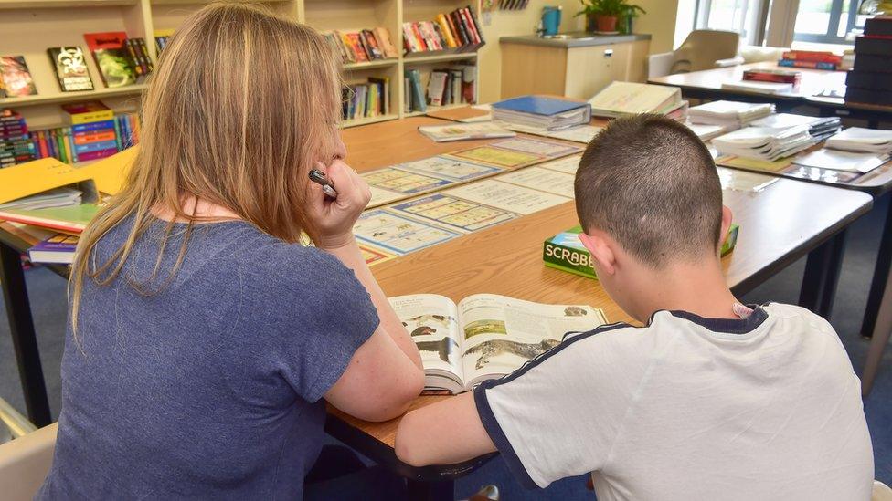 Child in Woodlands library