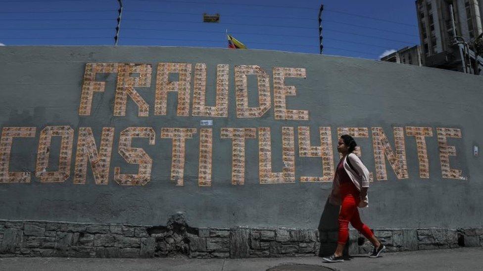 A sign made out of bank notes reads "Fraud constituent" in Caracas, Venezuela, 29 July 2017.