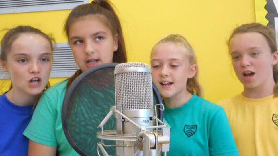 The children recorded a song they called The Extinction Will Not Be Televised