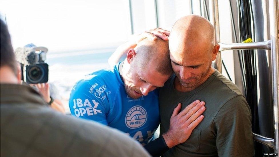 Australian surfer Mick Fanning hugs US Kelly Slater