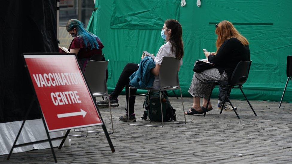 People waiting after their vaccinations in Scotland