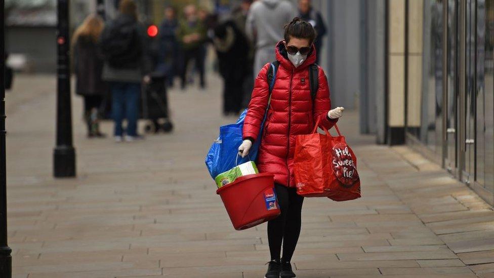 lone shopper wearing a mask