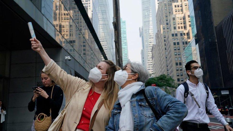 People wearing masks in new york