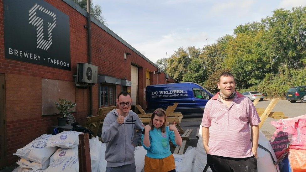 trainees outside the brewery