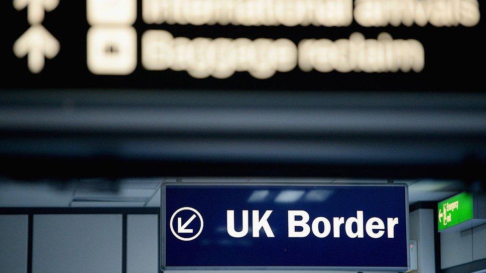 Immigration and border control signs at Edinburgh Airport