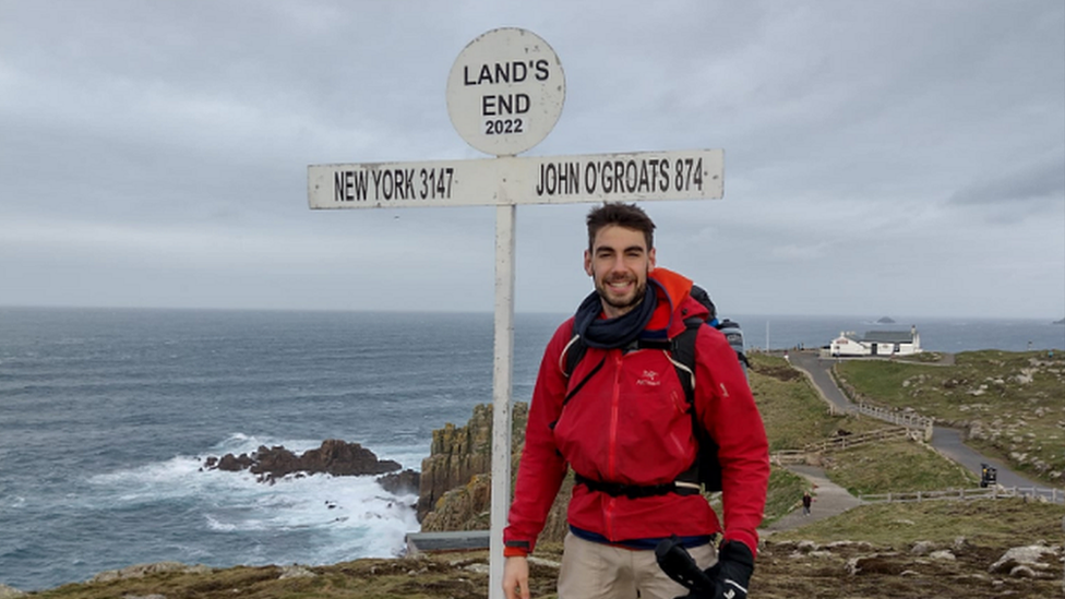 Robert Stanfield next to Lands End sign