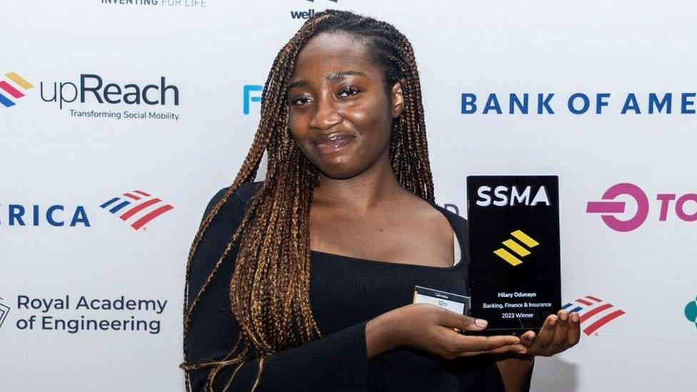 Hilary Odun with an award