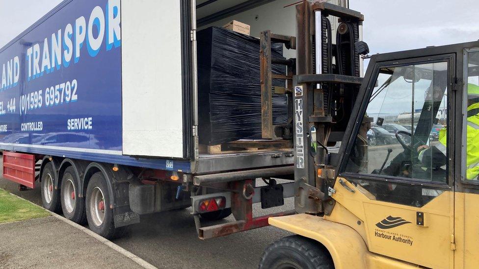 Fork lift truck and pallets of food