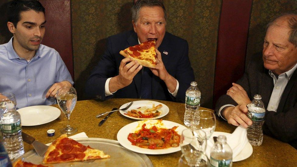 John Kasich eating pizza