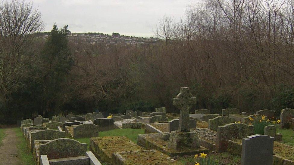 Tina's home can be seen from the graveyard