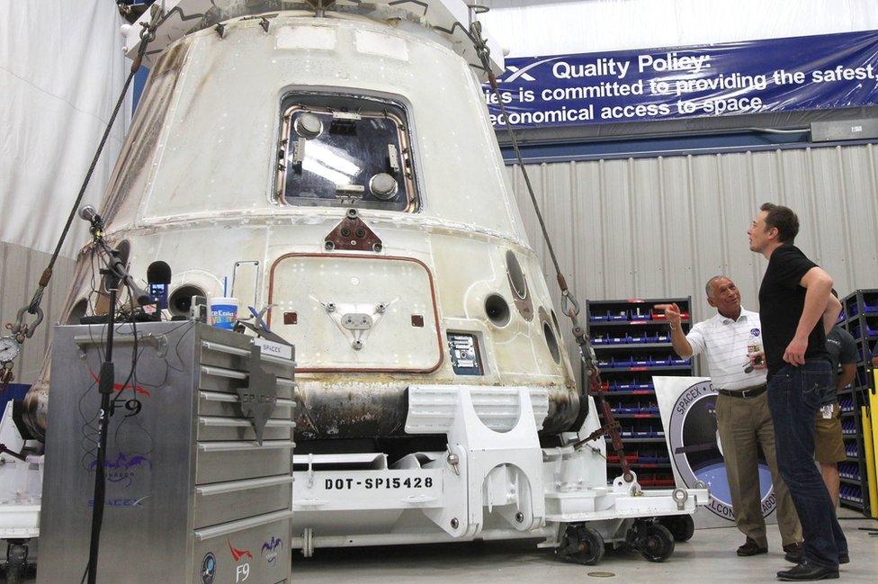 In this file photo of 13 June 2012, NASA Administrator Charles Bolden, second right, and SpaceX CEO Elon Musk, right, look at the SpaceX Dragon spacecraft at the SpaceX Rocket Development Facility in McGregor, Texas.