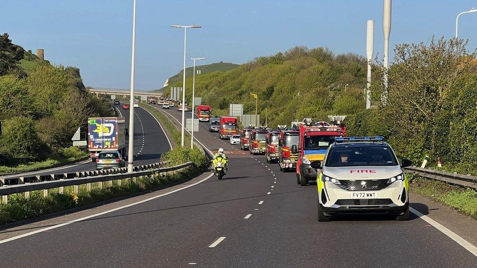 Convoy travelling with a police escort