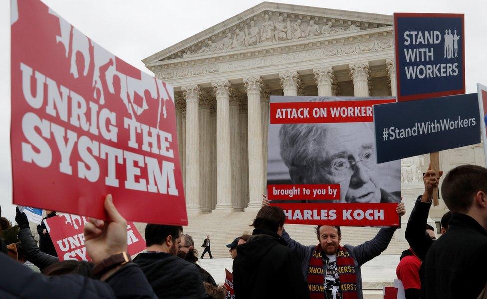 Union members gather outside of the United States Supreme Court in Washington, U.S., February 26, 2018.