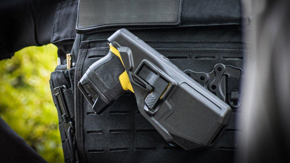 Taser in police offer's holster