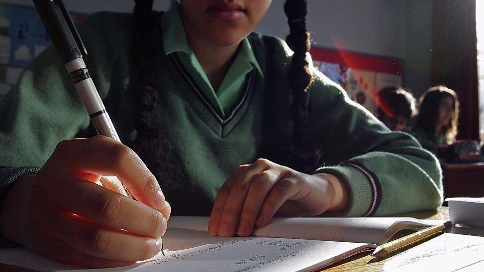 Schoolgirl working