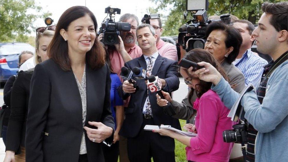 Senator Kelly Ayotte walks away from reporters Tuesday Oct. 4, 2016 in Hudson, New Hampshire
