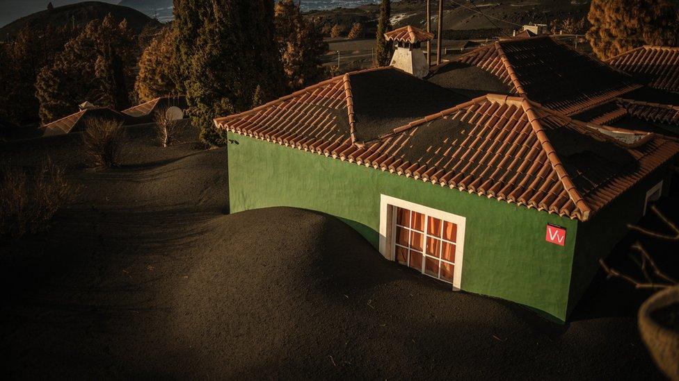 Volcano ash blanket and house