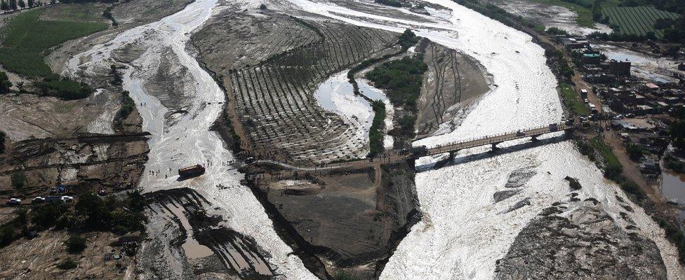 Aerial view of a collapsed road after a massive landslide and flood in Trujillo, northern Peru