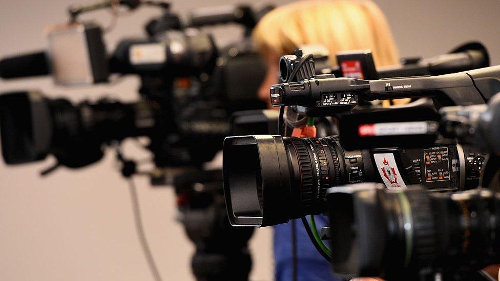 A row of TV cameras