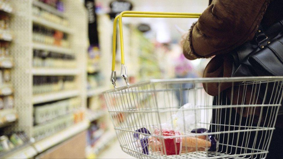 Woman carrying shopping basket