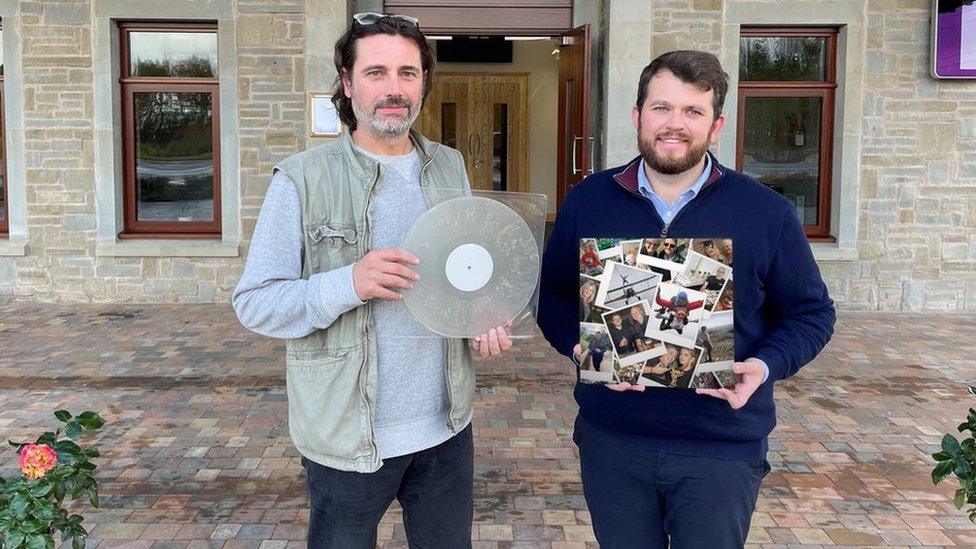 Jason Leach (left) and Matthew Brook (right) holding a vinyl and its sleeve