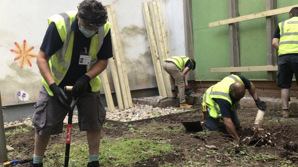 Workers creating the new garden