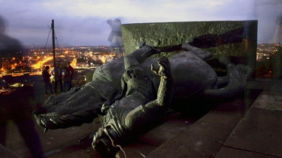 A picture made with a slow shutter speed shoes the Sebastian de Belalcazar monument that was demolished by indigenous communities in Popayan, Colombia, 16 September 2020.